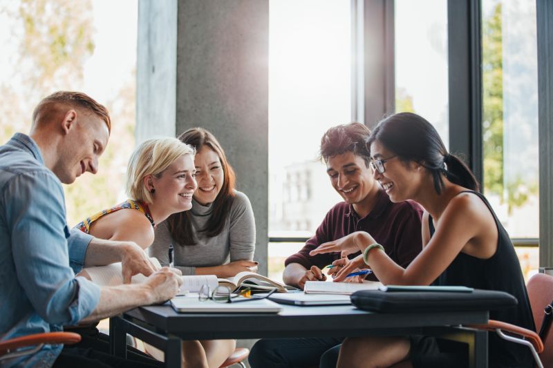 a group of students seated around a table