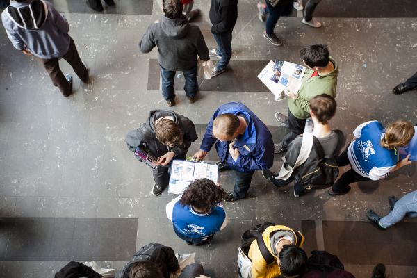 Student and Staff reading course brochure
