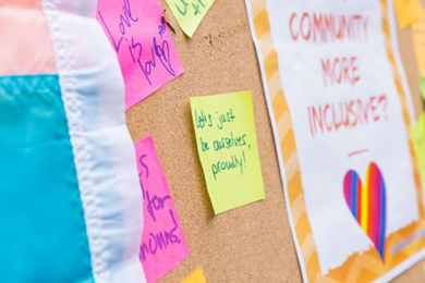 positive messages pinned to a cork noticeboard