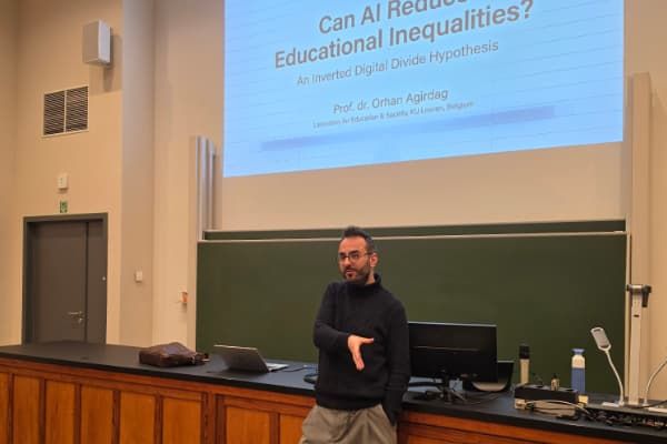 Lecturer presenting at the front of the classroom