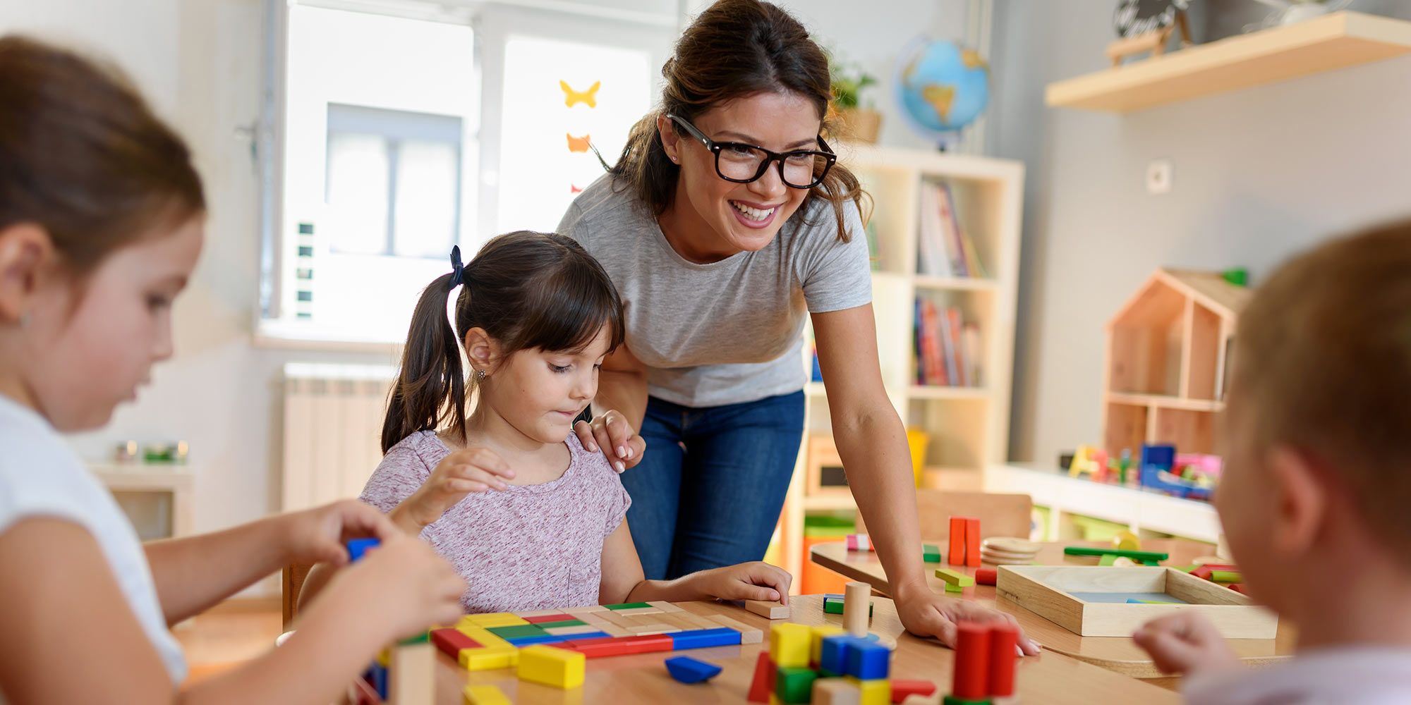 Kindergarten teacher with students